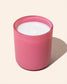 12 ounce noura blanc candle in flamingo pink candle jar flat lay image on ivory background